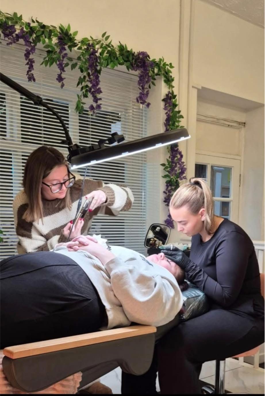 Two people working together during student model treatment